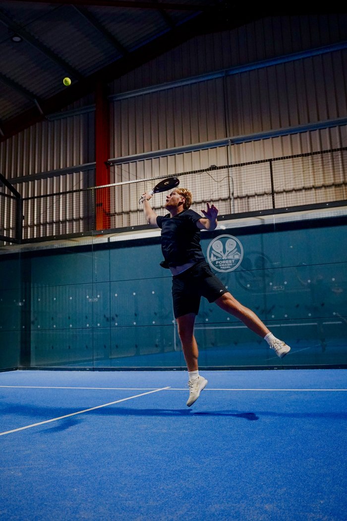 Moon Padel racket in action, overhead smash